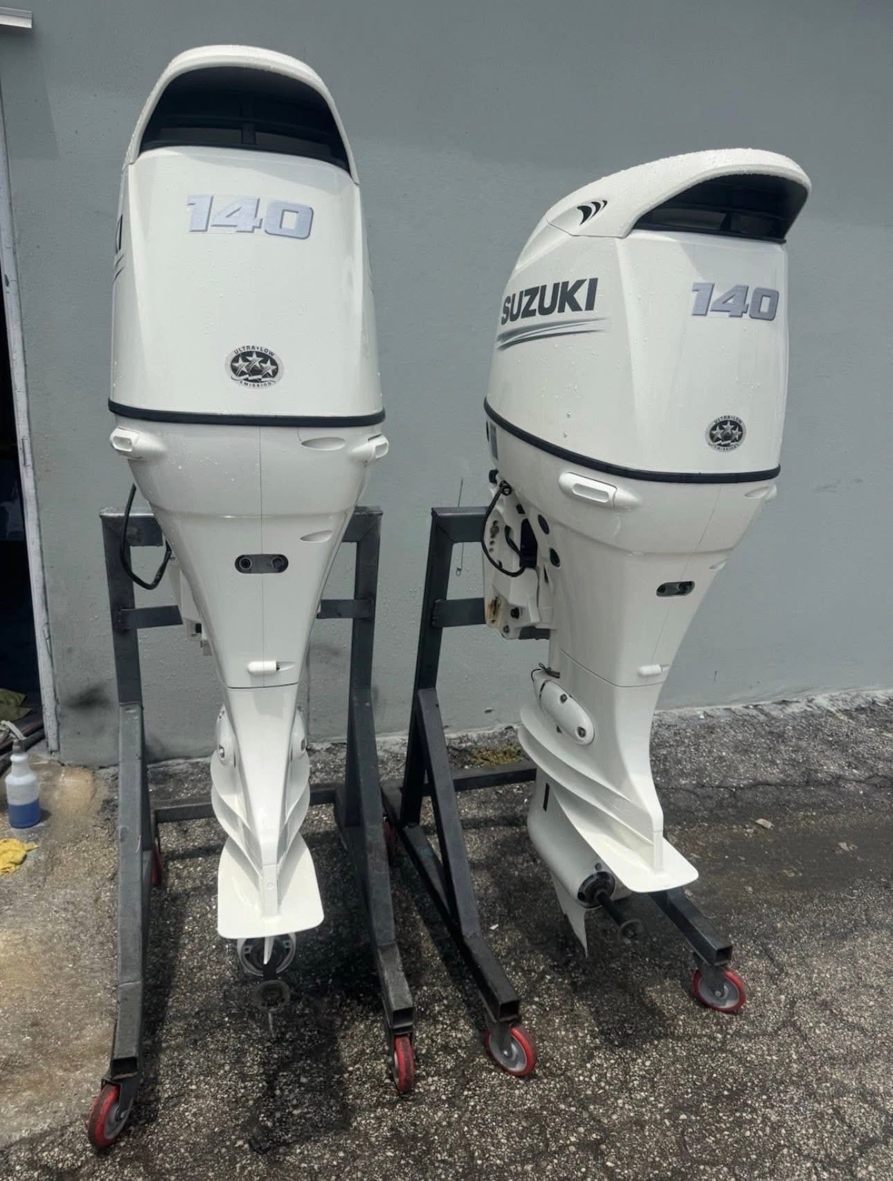 White Twin Suzuki 140 HP 4 Stroke Outboard Motor